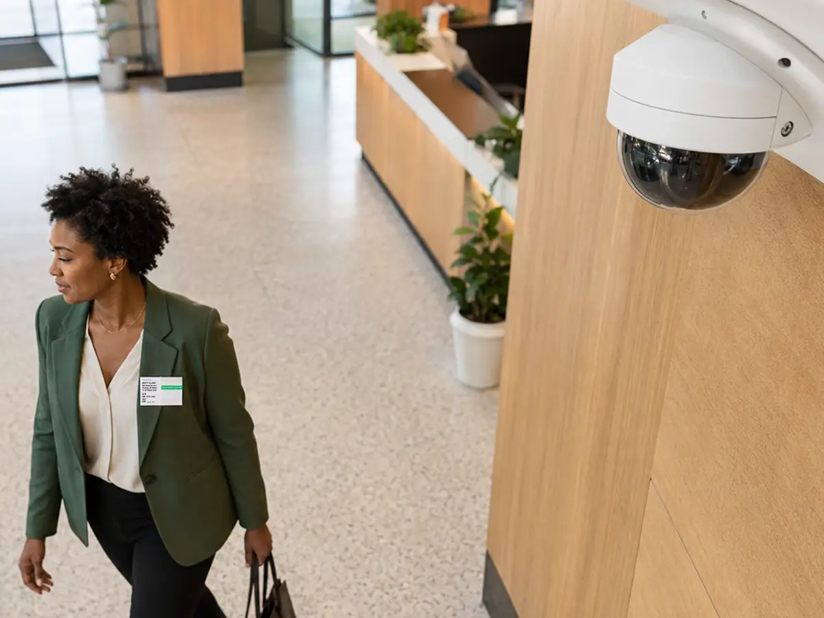 A camera view of a visitor badge with a color band that stays readable at a distance