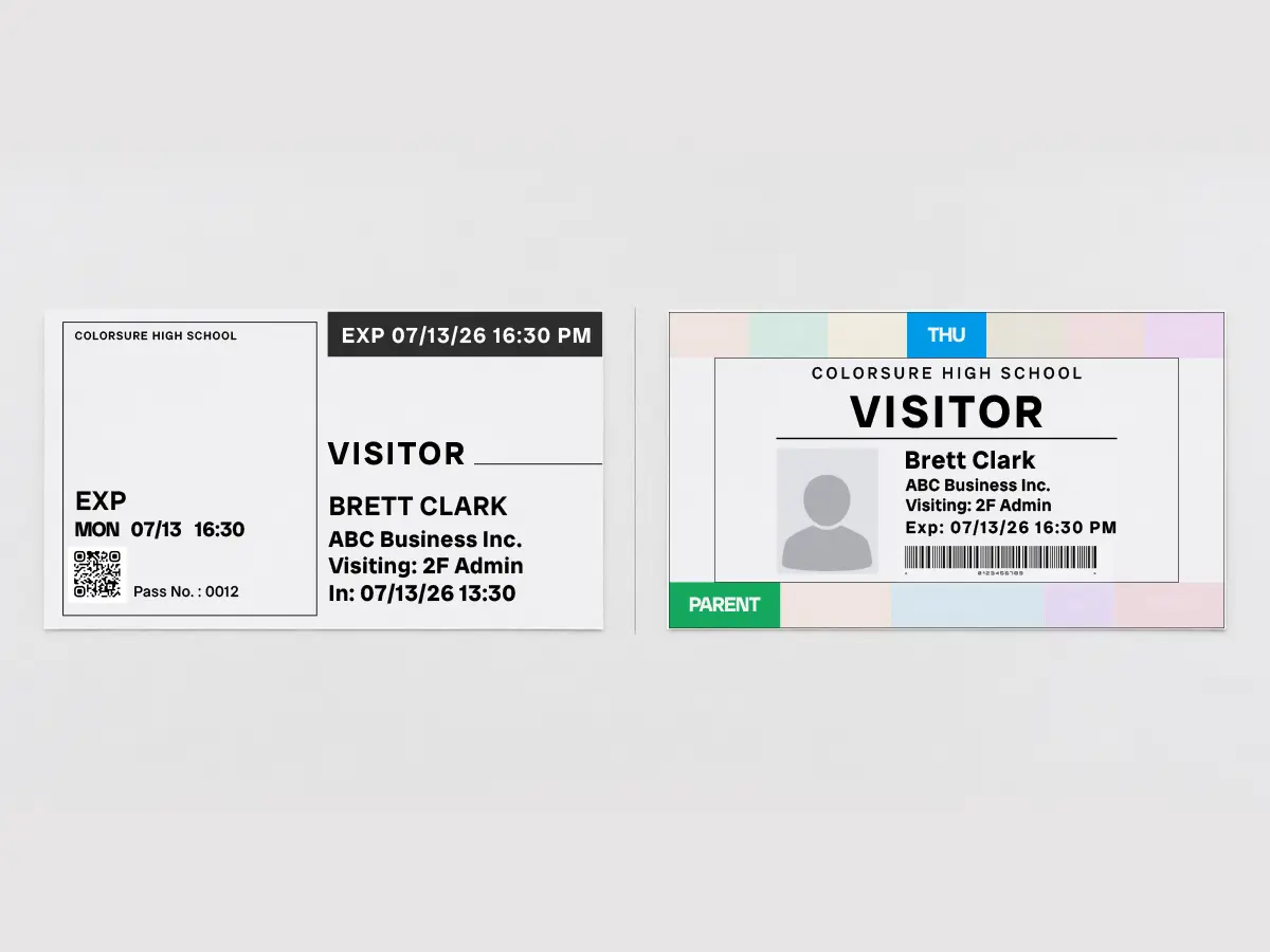 A black-and-white visitor badge beside a color badge, showing how little the monochrome badge stands out